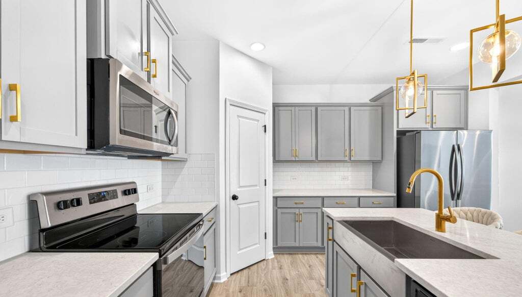 Kitchen with gray cabinets and farmhouse sink