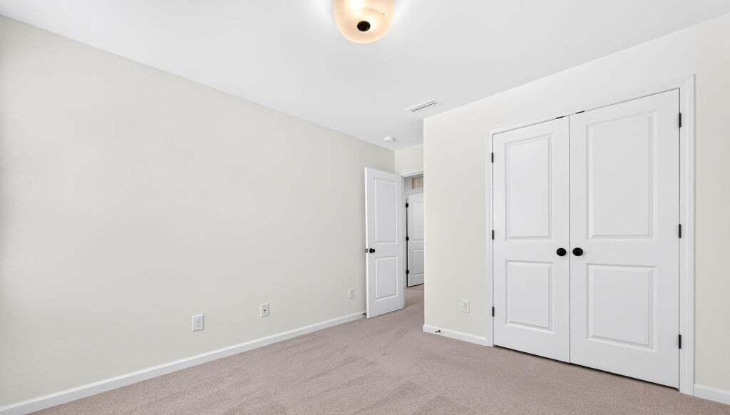 Secondary bedroom with double closet
